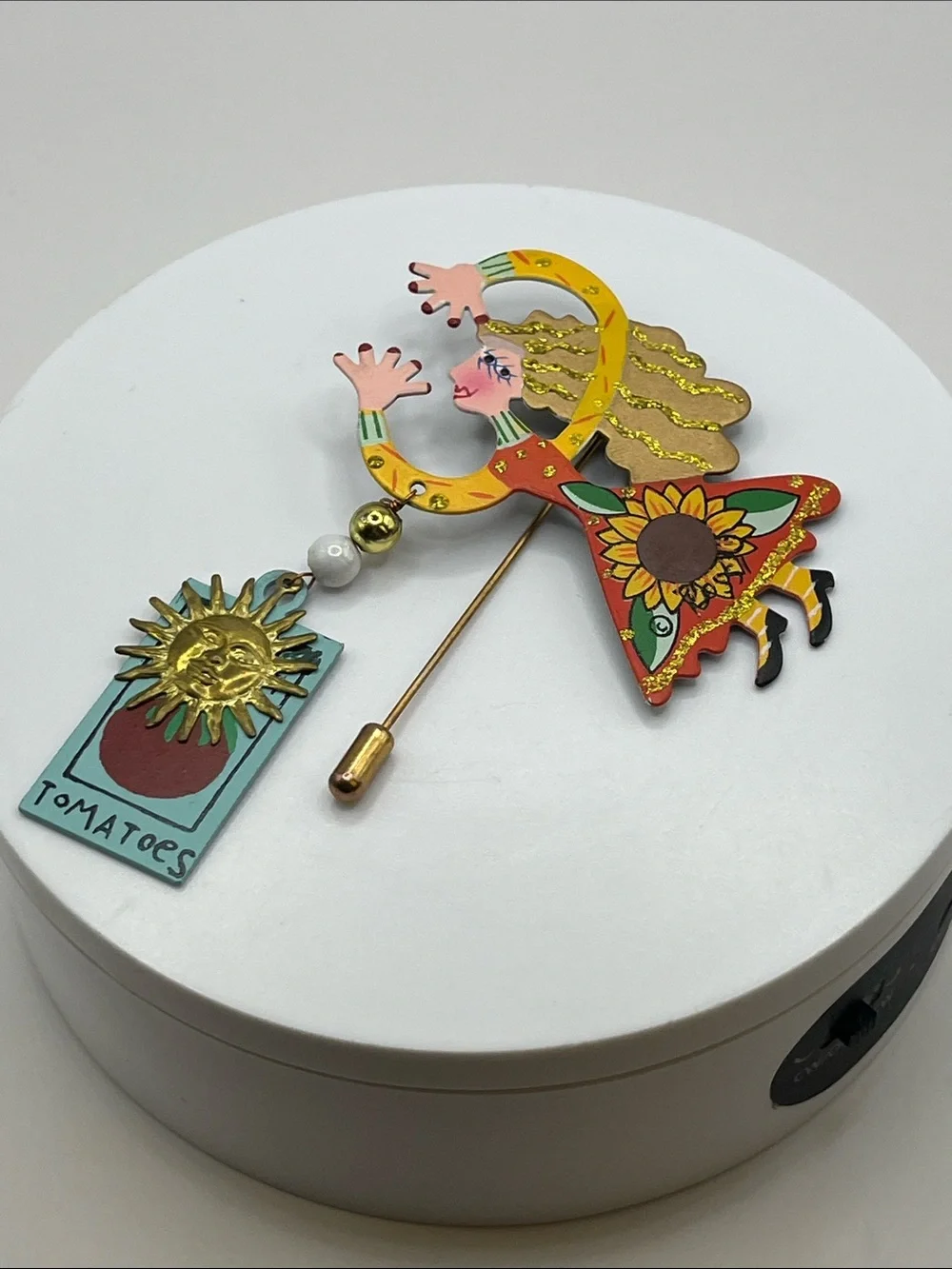 Signed Rossi flying lady stick pin brooch with a tomato sign